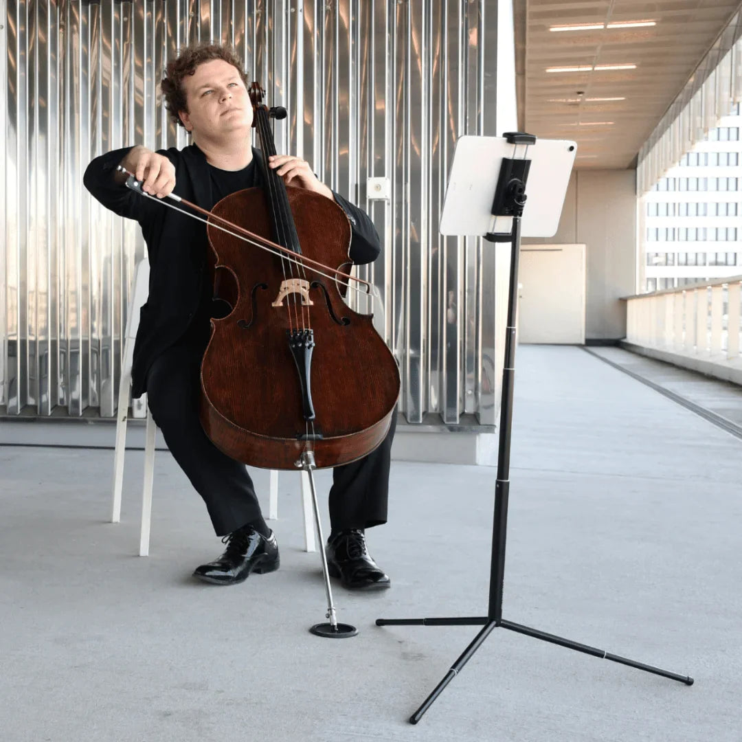 Musician using miniput music stand basic set while performing